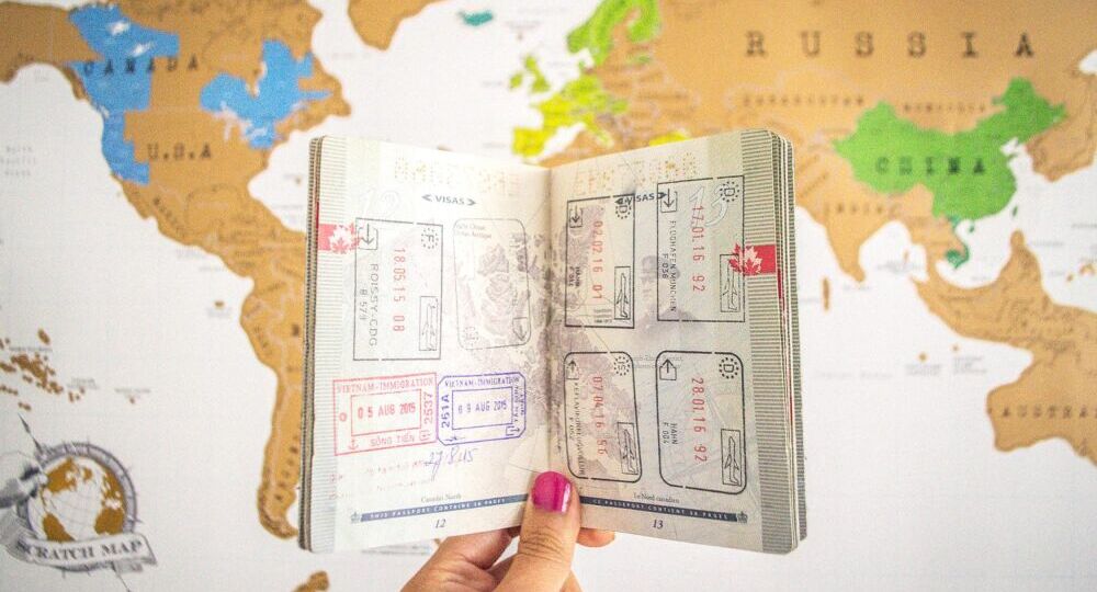 Passport-over-Map-Happy-to-Wander-1-1